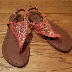 Orange sandals with gold design